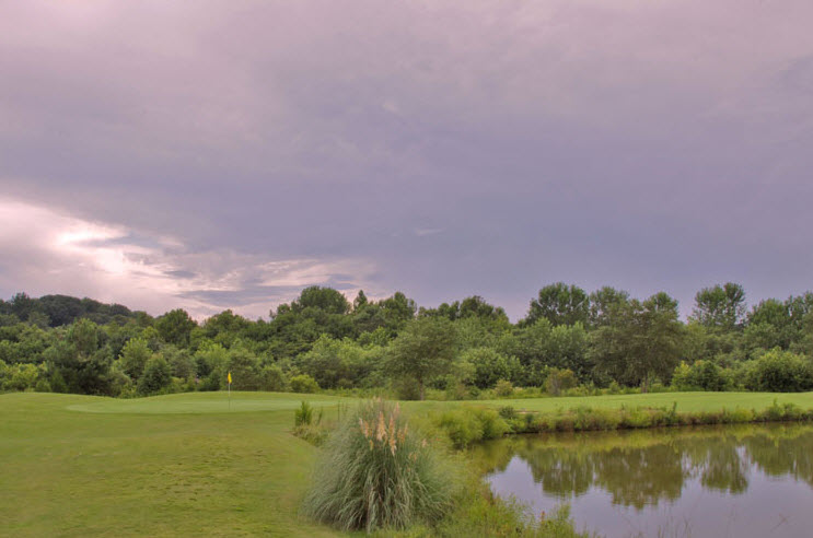 Image: Ominous clouds over fairway and lake at Salem Glen Country Club | Clemmons NC