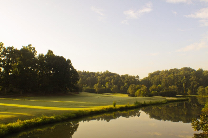 Image: Narrow fairway with water in foreground at Salem Glen Country Club | Clemmons NC
