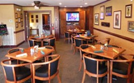 Image: Tables and chairs in the Bistro grill.