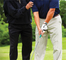 Image: Pro giving golf lesson