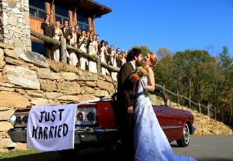 Image: Couple Standing Beside Vintage Car With Just Married Sign
