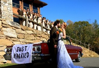Image: Couple Standing Beside Vintage Car With Just Married Sign